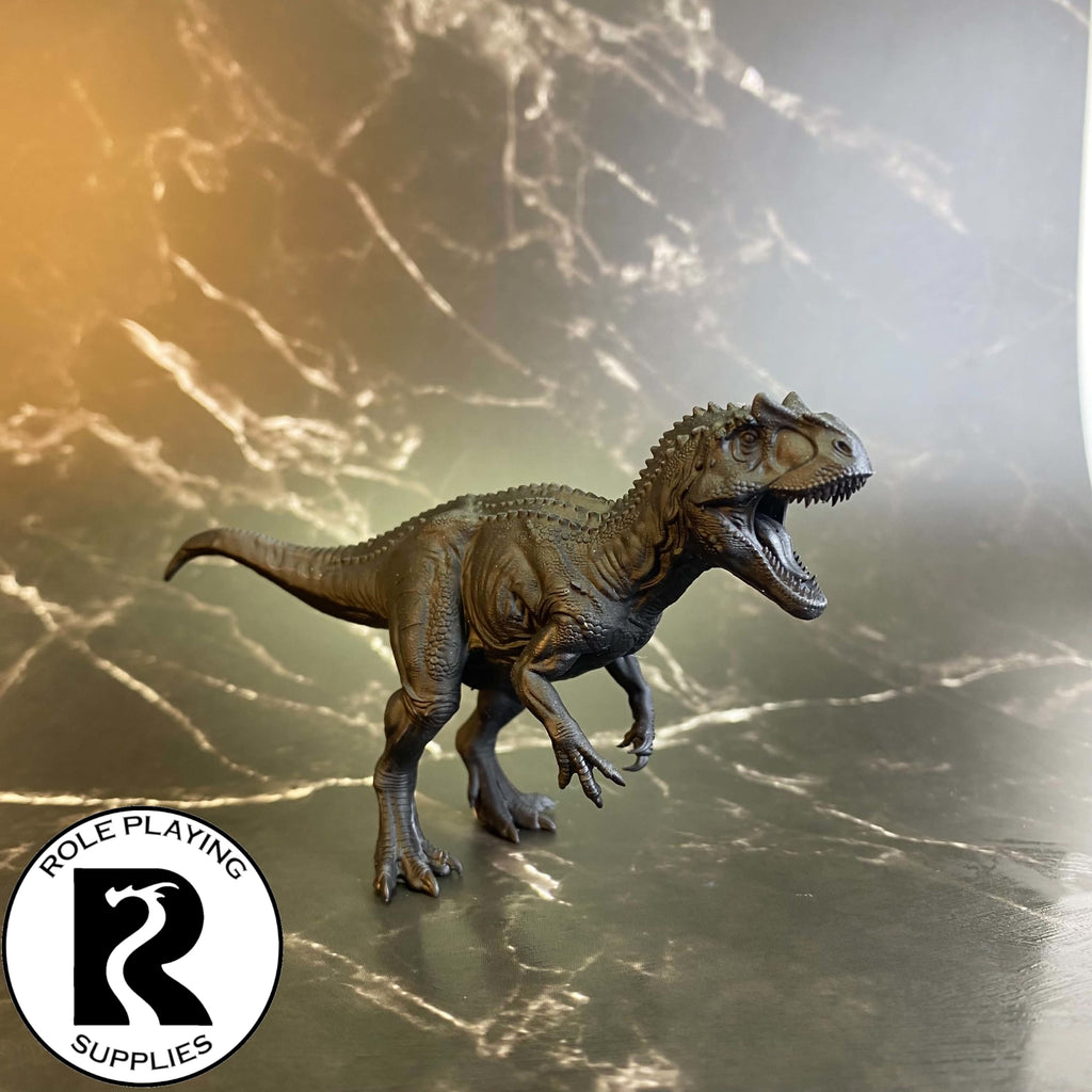 A dnd miniature allosaurus primed in black.
