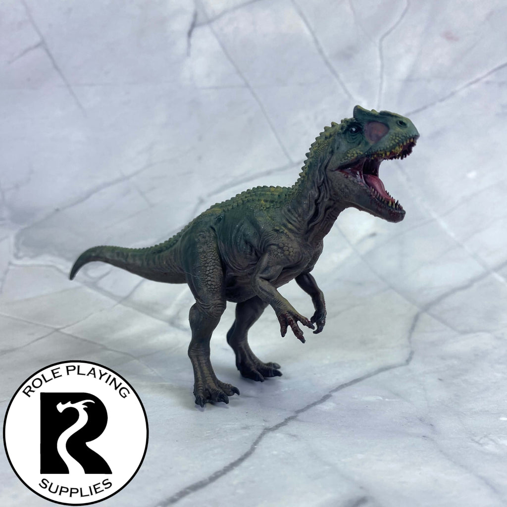 A dnd miniatureallosaurus painted.