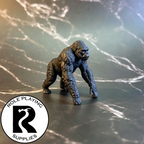 A dnd miniature ape primed in black.
