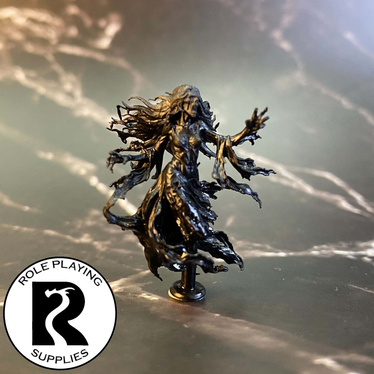 A dnd miniature banshee primed in black.
