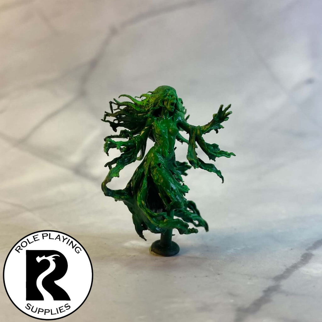 A dnd miniature banshee painted.
