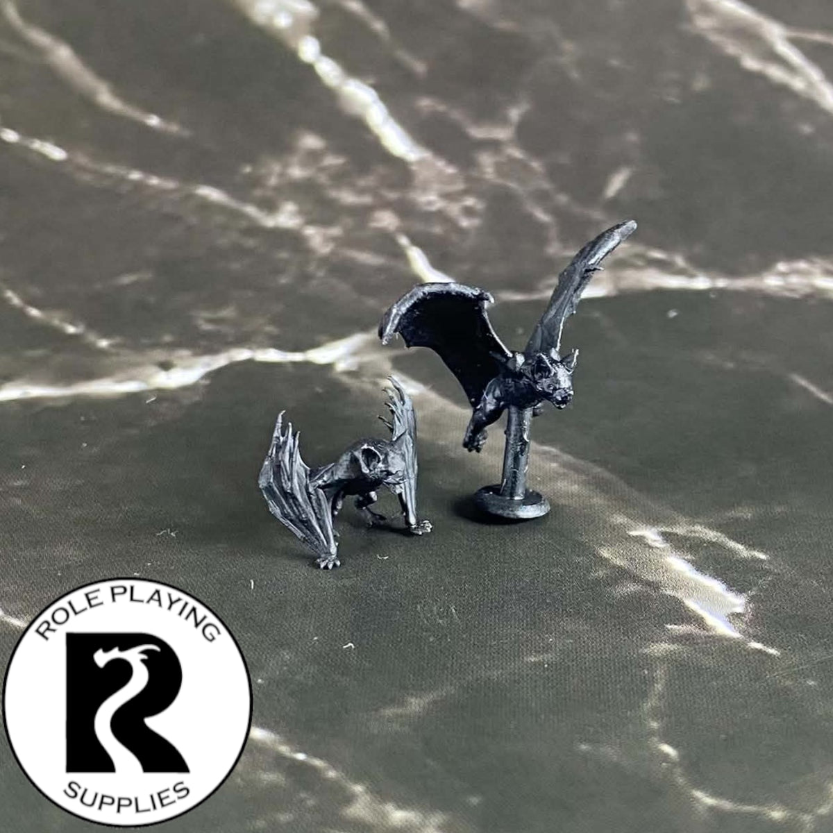 A dnd miniature bat primed in black.
