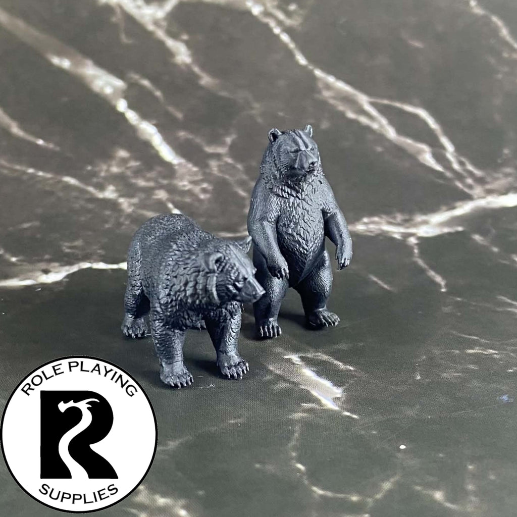 A dnd miniature black bear primed in black.
