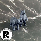A dnd miniature black bear primed in black.
