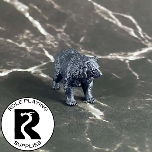 A dnd miniature black bear primed in black.
