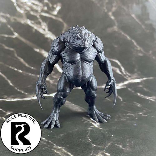 A dnd miniature blue slaad primed in black.

