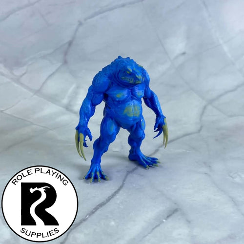 A dnd miniature blue slaad painted.
