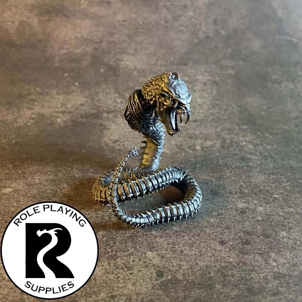 A dnd miniature bone naga primed in black 28mm scale.