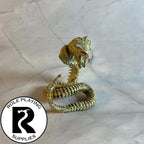 A dnd miniature bone naga painted 28mm scale.
