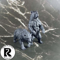 A dnd miniature brown bear primed in black.
