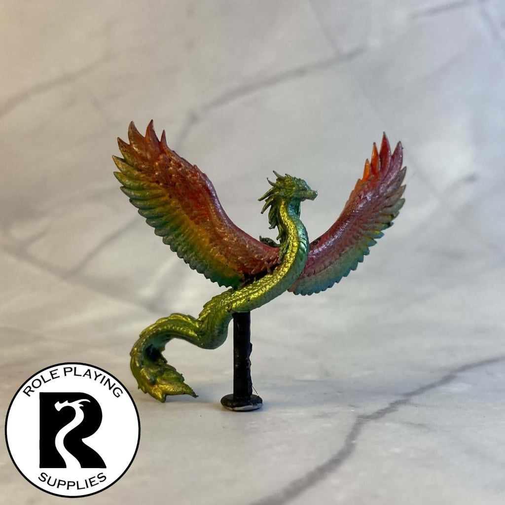 A dnd miniature couatl painted.
