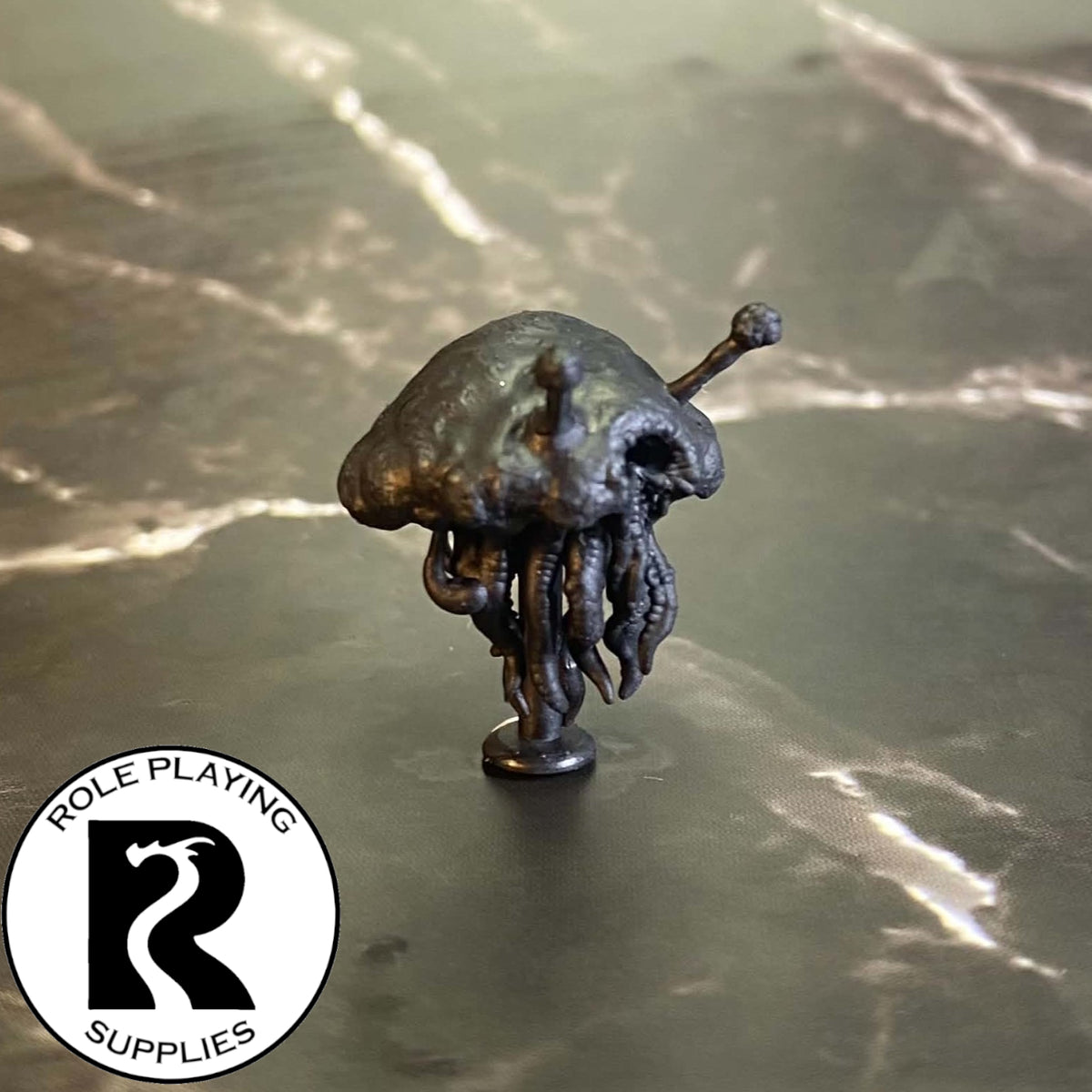 A dnd miniature flumph primed in black.