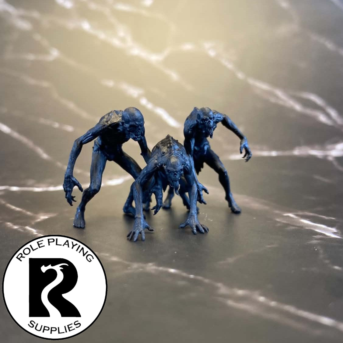 A dnd miniature ghoul primed in black.
