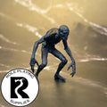 A dnd miniature ghoul primed in black.
