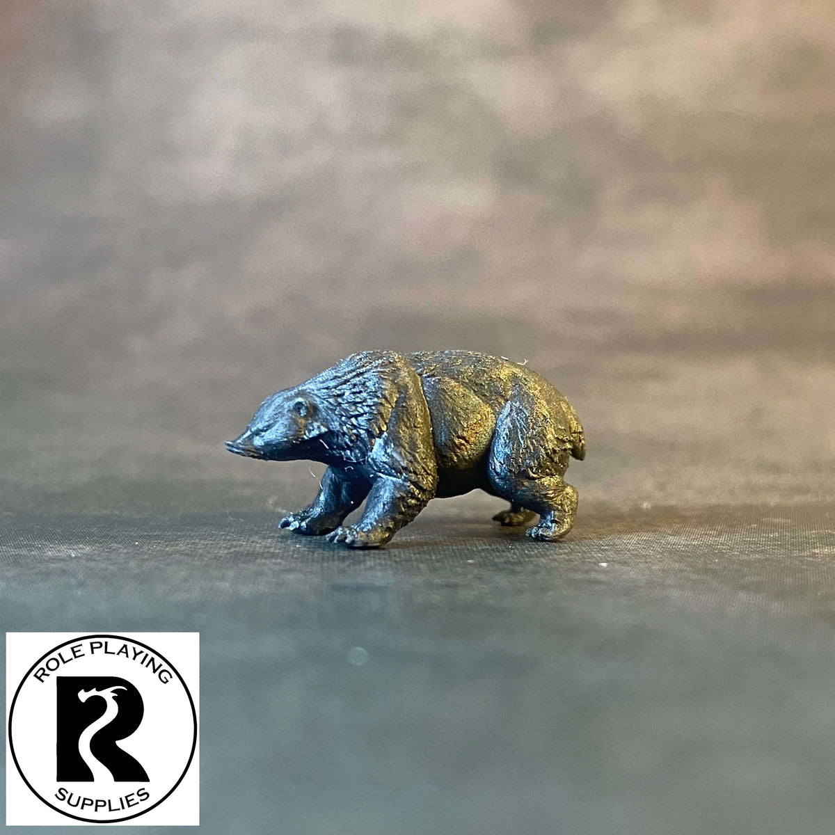 A dnd miniature giant badger primed in black.