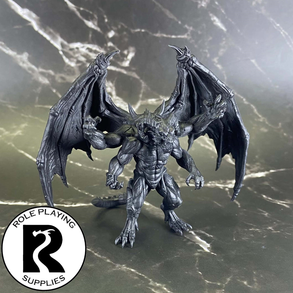 A dnd miniature giant four-armed gargoyle primed in black.
