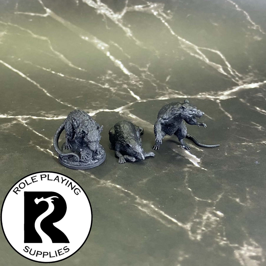A dnd miniature giant rat primed in black.

