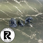 A dnd miniature giant rat primed in black.

