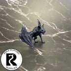 A dnd miniature giant bat primed in black.
