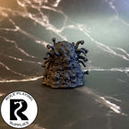 A dnd miniature gibbering mouther primed in black.
