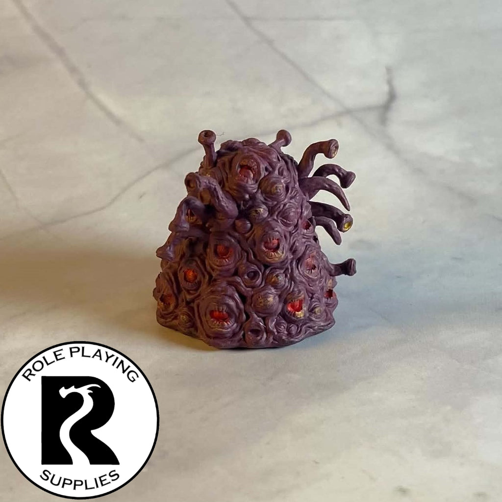 A dnd miniature gibbering mouther painted.
