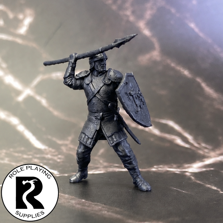 A dnd miniature guard primed in black.
