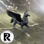 A dnd miniature hippogriff primed in black.
