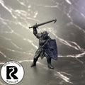 A dnd miniature hobgoblin primed in black.
