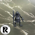 A dnd miniature kuo-toa primed in black.
