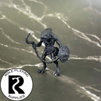 A dnd miniature kuo-toa whip primed in black.
