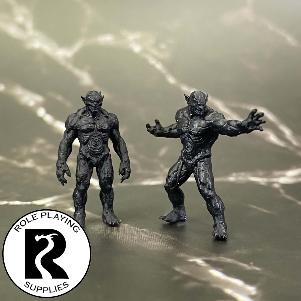 A dnd miniature magmin primed in black.
