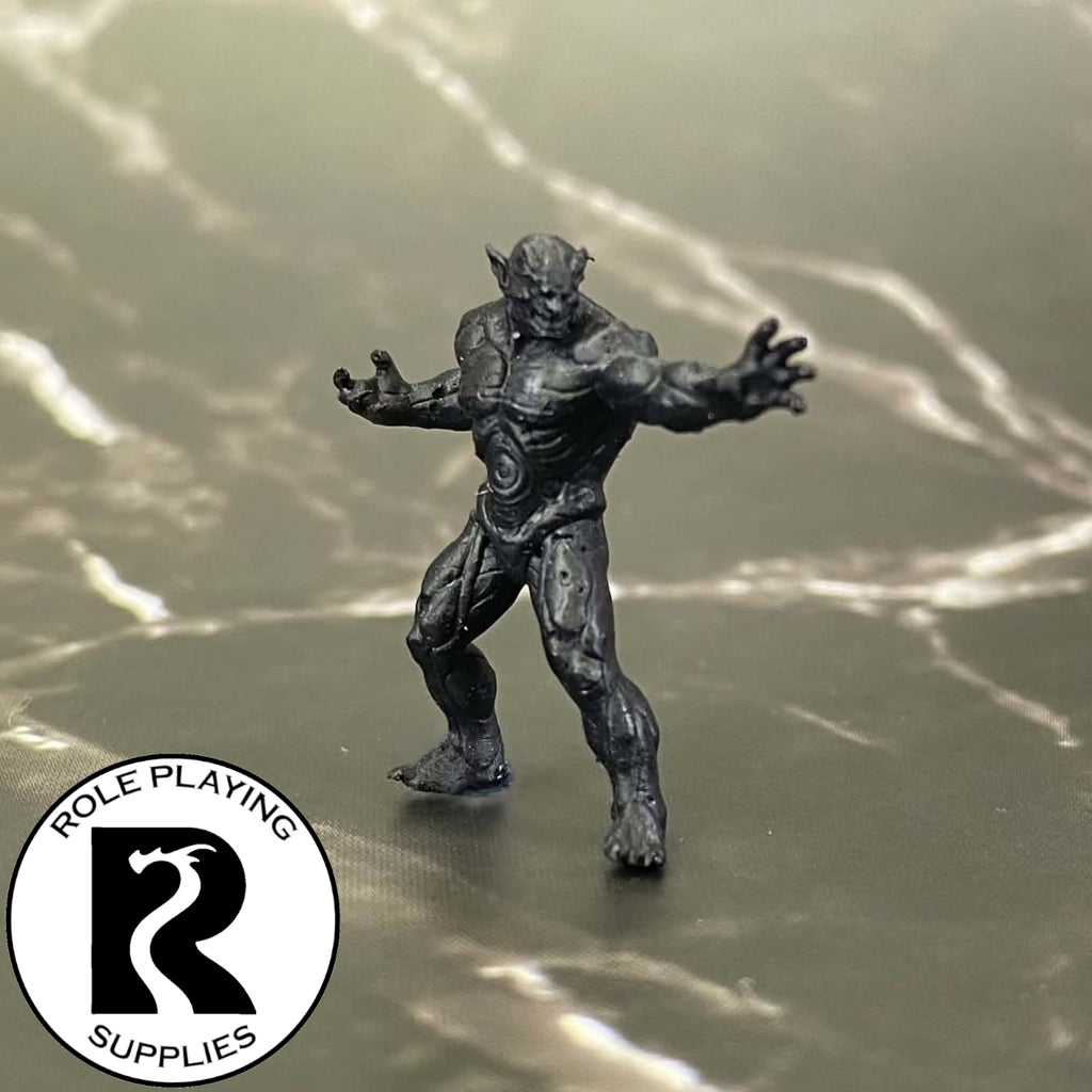 A dnd miniature magmin primed in black.
