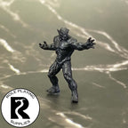 A dnd miniature magmin primed in black.
