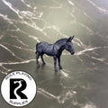 A dnd miniature mule primed in black.
