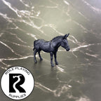 A dnd miniature mule primed in black.
