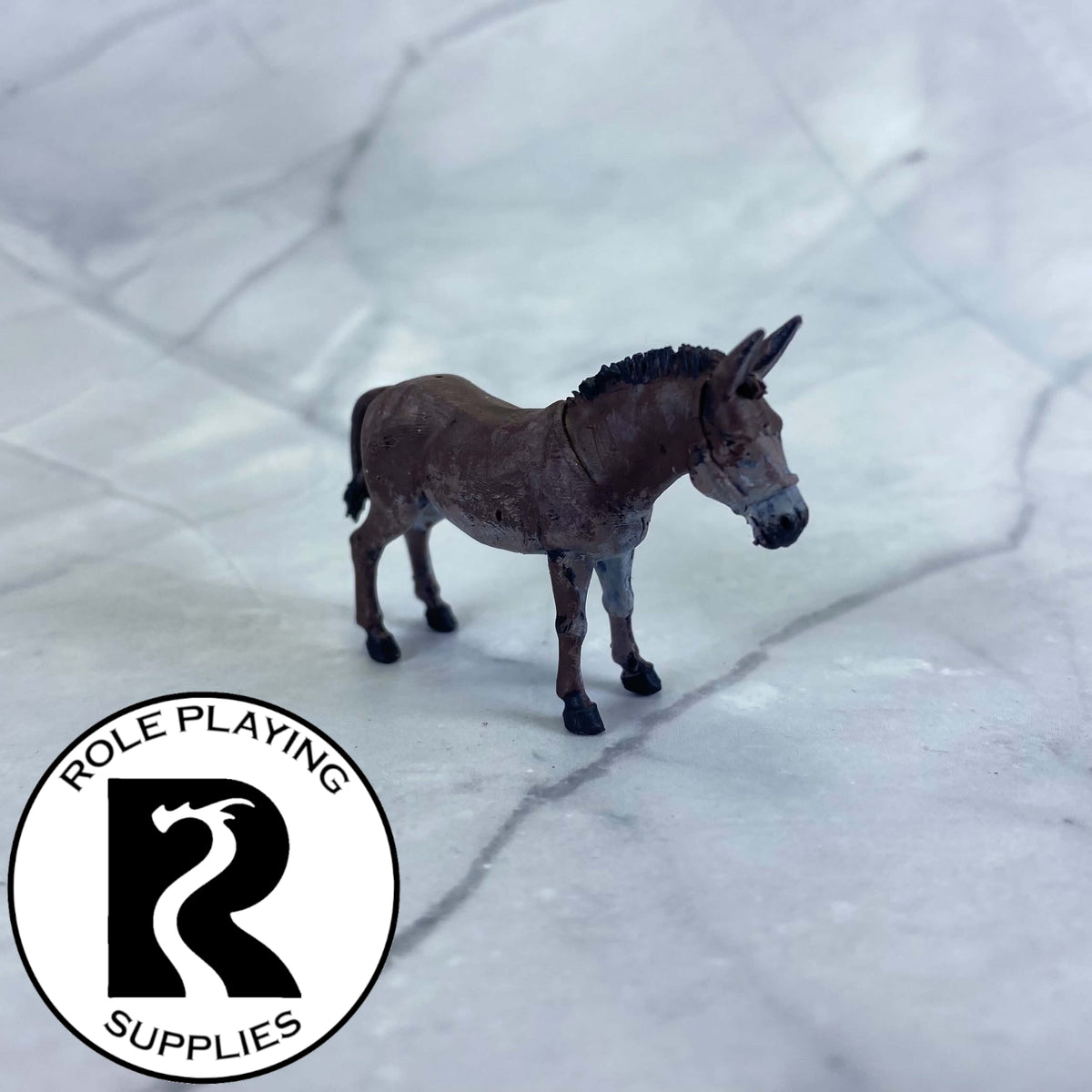 A dnd miniature mule painted.
