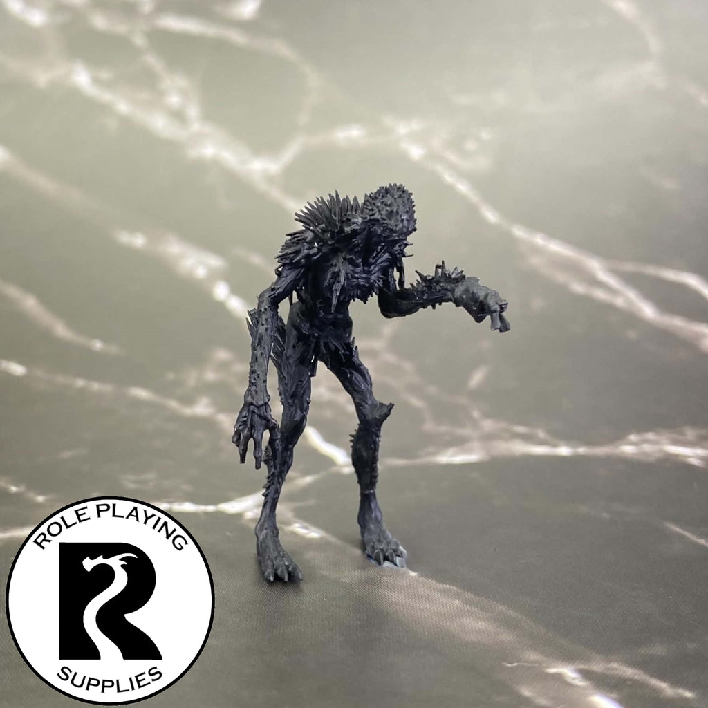 A dnd miniature needle blight primed in black.
