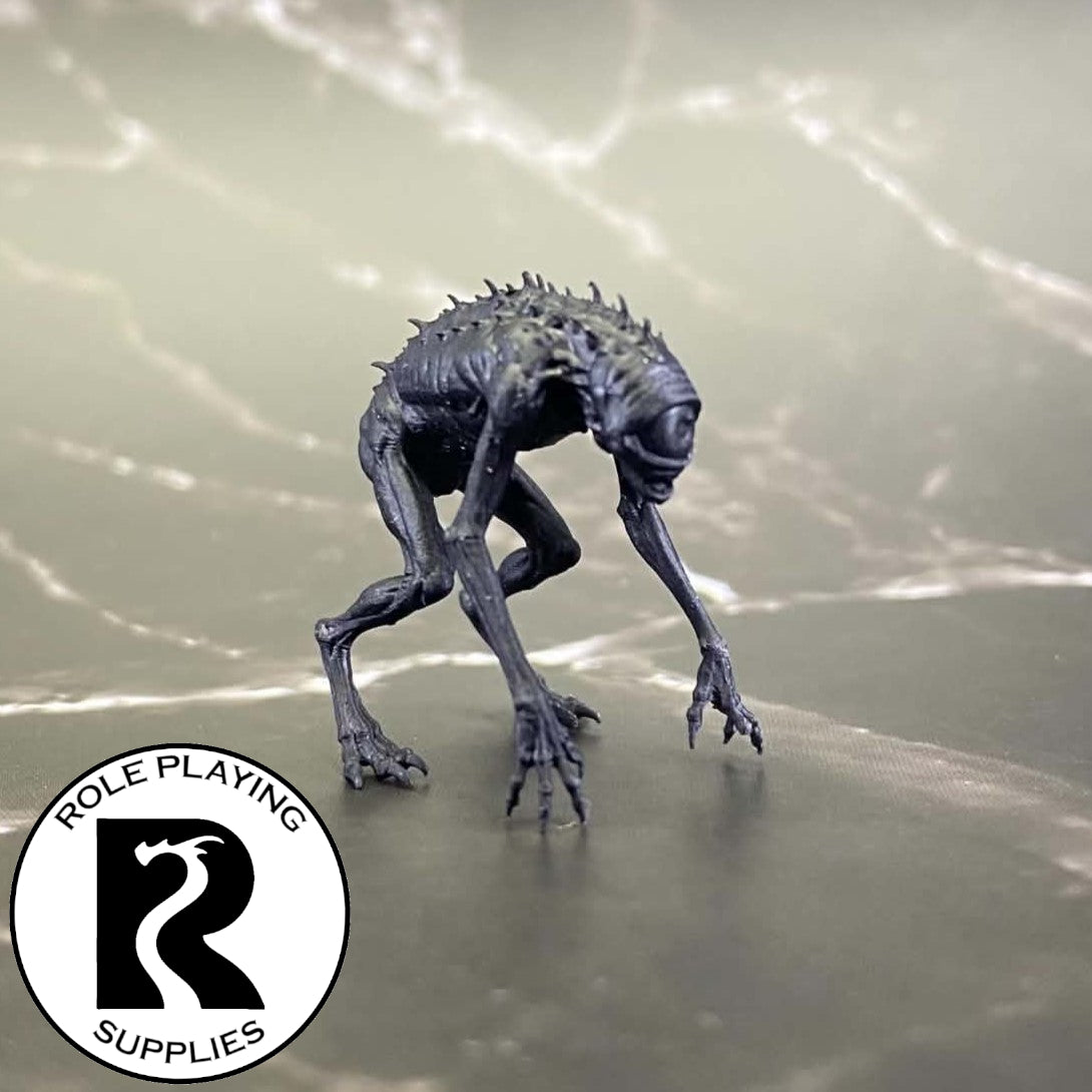 A dnd miniature nothic primed in black.
