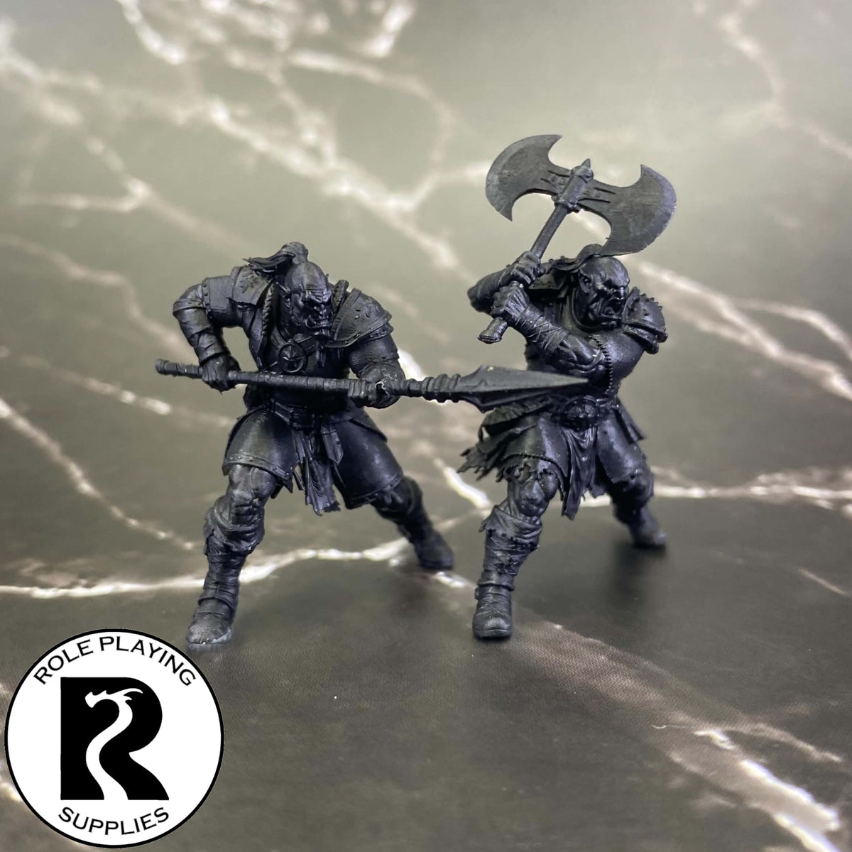 A dnd miniature orc war chief primed in black.
