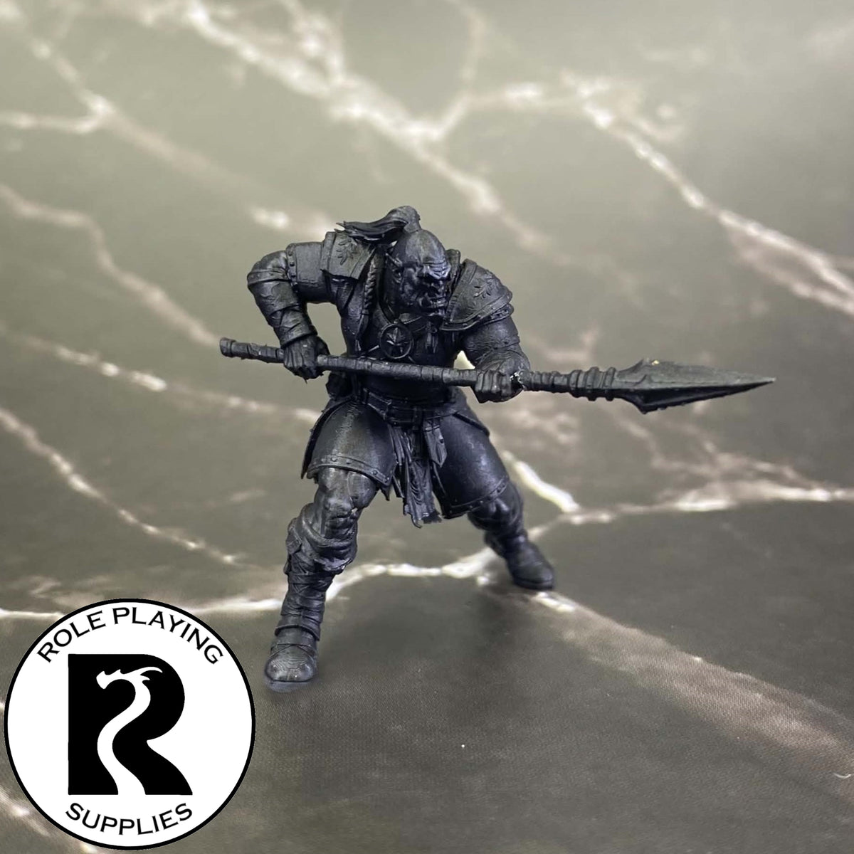 A dnd miniature orc war chief primed in black.
