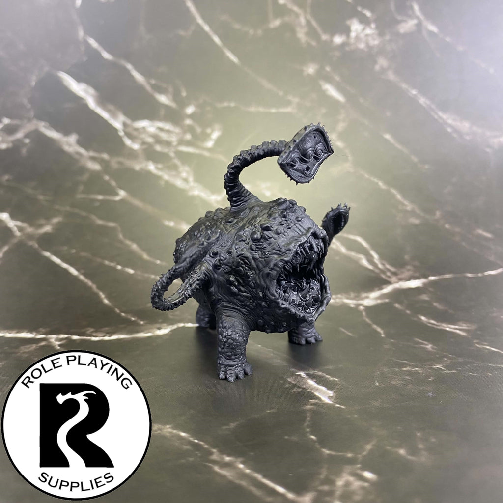 A dnd miniature otyugh primed in black.
