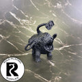 A dnd miniature otyugh primed in black.
