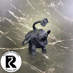 A dnd miniature otyugh primed in black.
