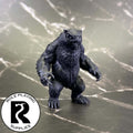 A dnd miniature owlbear primed in black.
