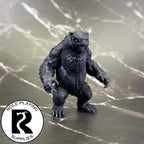 A dnd miniature owlbear primed in black.
