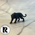 A dnd miniature panther painted.
