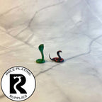 A dnd miniature poisonous snake painted.
