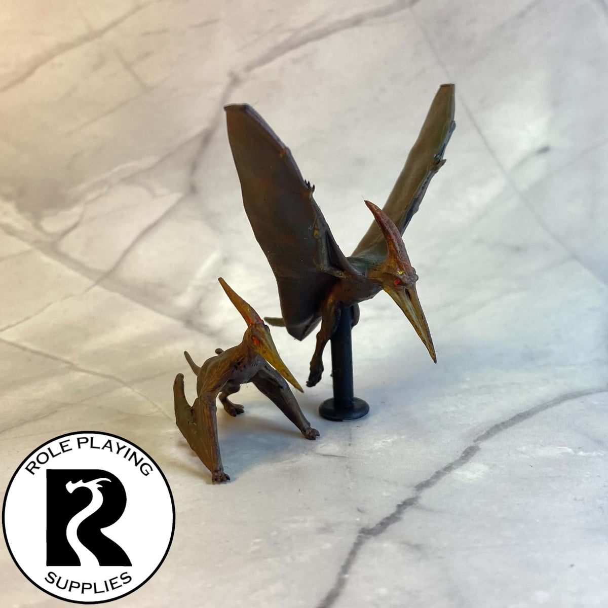 A dnd miniature pteranodon pair painted.

