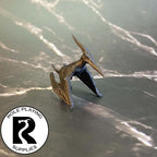 A dnd miniature pteranodon primed in black.
