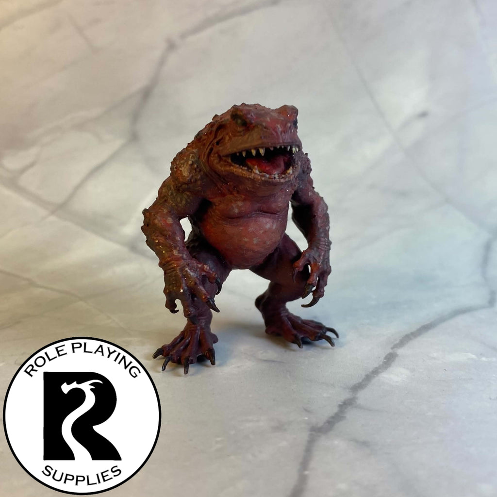 A dnd miniature red slaad painted.
